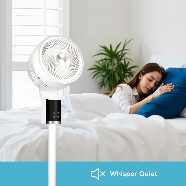 woman sleeping on a bed behind a white pedestal fan